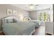 Bright bedroom featuring two beds and natural light from the windows at 9776 Leyland Dr. # 2, Myrtle Beach, SC 29572