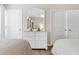 Bright bedroom featuring two beds, a mirrored dresser, and two white doors at 9776 Leyland Dr. # 2, Myrtle Beach, SC 29572