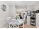 Inviting dining area with nautical decor open to living room featuring lots of natural light at 9776 Leyland Dr. # 2, Myrtle Beach, SC 29572