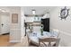 Cozy dining area with a round table, comfortable seating, and a view of the kitchen at 9776 Leyland Dr. # 2, Myrtle Beach, SC 29572