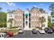 Condo complex with stone accents, palm trees, and well-maintained landscaping creates an inviting, coastal feel at 9776 Leyland Dr. # 2, Myrtle Beach, SC 29572