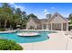 Stunning community pool area with a central fountain, surrounded by lush landscaping and seating at 9776 Leyland Dr. # 2, Myrtle Beach, SC 29572