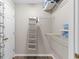 Walk-in closet featuring shelving and hanging storage with wood-look floors at 9776 Leyland Dr. # 2, Myrtle Beach, SC 29572