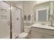 Modern bathroom with a glass-enclosed shower, sleek fixtures, and white subway tile at 1098 Laconic Dr., Myrtle Beach, SC 29588