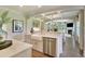 Kitchen with farmhouse sink, stainless dishwasher, and archway leading to living room at 1098 Laconic Dr., Myrtle Beach, SC 29588