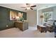 Stylish office space with dark green paneling, large desk, and comfortable seating at 1098 Laconic Dr., Myrtle Beach, SC 29588