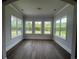 Bright sunroom with ample natural light and hardwood floors at 1098 Laconic Dr., Myrtle Beach, SC 29588