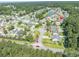 Aerial view of the community, showing location with nearby lake and wooded areas at 110 Ashworth Dr., Little River, SC 29566