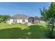 Well-maintained backyard featuring a screened-in porch, and patio at 110 Ashworth Dr., Little River, SC 29566