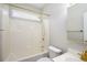 Bathroom featuring a bath tub with shower and sink with cabinet at 110 Ashworth Dr., Little River, SC 29566