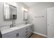 Bathroom featuring double vanities, gray cabinets, and modern fixtures at 110 Ashworth Dr., Little River, SC 29566