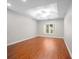 Bedroom with wood flooring and a window providing ample natural light at 110 Ashworth Dr., Little River, SC 29566