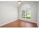 Bright bedroom with wood floors, a vaulted ceiling, and arched window providing natural light at 110 Ashworth Dr., Little River, SC 29566