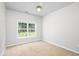 Neutral bedroom featuring a ceiling fan and a large window providing natural light at 110 Ashworth Dr., Little River, SC 29566