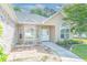 Inviting front entrance with a quaint patio and large arched window at 110 Ashworth Dr., Little River, SC 29566