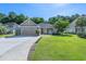 Charming single-story home with a well-manicured lawn and attached two-car garage at 110 Ashworth Dr., Little River, SC 29566