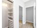 Hallway featuring built-in storage and open doorways to closets at 110 Ashworth Dr., Little River, SC 29566