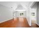Spacious living room with vaulted ceilings, neutral paint, and hardwood floors at 110 Ashworth Dr., Little River, SC 29566