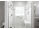 Modern tiled shower with glass enclosure, seating and showerhead at 110 Ashworth Dr., Little River, SC 29566
