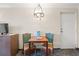 Small dining area featuring a wooden table, 2 chairs, artwork, and a hanging light fixture at 1105 S Ocean Blvd. # 250, Myrtle Beach, SC 29577