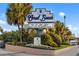 Coral Beach Resort entrance sign boasts amenities like pools, a beach bar, and a bowling center at 1105 S Ocean Blvd. # 250, Myrtle Beach, SC 29577