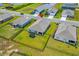 Aerial view showcasing the home's spacious backyard, neighborhood, and surrounding community at 115 Spring Wheat Way, Conway, SC 29527