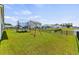 Spacious backyard featuring a trampoline, playset, and a scenic pond view at 115 Spring Wheat Way, Conway, SC 29527