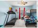 Spacious bedroom with bunkbeds, a treadmill, ceiling fan, and window with neighborhood view at 115 Spring Wheat Way, Conway, SC 29527