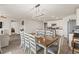 Dining area with an elegant chandelier, seamlessly connecting to the kitchen at 115 Spring Wheat Way, Conway, SC 29527