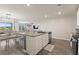 Kitchen island with granite countertops overlooking a dining area and the backyard at 115 Spring Wheat Way, Conway, SC 29527