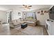 Bright and airy living room with a sectional sofa, hardwood floors, and a serene outdoor view at 115 Spring Wheat Way, Conway, SC 29527