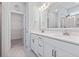 Modern bathroom with double vanity, quartz counters, framed mirror, and glass shower enclosure at 1178 Pyxie Moss Dr., Little River, SC 29566