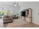 Inviting living room boasts a soaring ceiling, neutral furniture, and large entertainment center at 1178 Pyxie Moss Dr., Little River, SC 29566