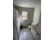 Bathroom featuring tiled floor and shower, vanity with counter, toilet, and window at 124 Orange St., Georgetown, SC 29440