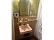 Small bathroom featuring vintage tile, wallpaper, and a pink sink at 124 Orange St., Georgetown, SC 29440