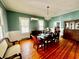 Dining room features a dining table with seating for eight, hardwood floors and decorative lighting at 124 Orange St., Georgetown, SC 29440