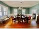 Traditional dining room showcasing hardwood floors, seating for eight, and decorative light fixture at 124 Orange St., Georgetown, SC 29440