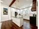 Bright kitchen featuring a marble island, stainless steel appliances, and hardwood flooring at 124 Orange St., Georgetown, SC 29440