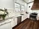 Well-lit kitchen featuring stainless steel appliances, white countertops, and a modern backsplash at 124 Orange St., Georgetown, SC 29440