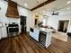 Contemporary kitchen featuring a kitchen island, stainless steel oven, and access to the living area at 124 Orange St., Georgetown, SC 29440