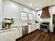 Bright kitchen with stainless steel appliances, marble countertops and white cabinetry at 124 Orange St., Georgetown, SC 29440