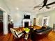 Cozy living room featuring a decorative fireplace, hardwood floors, and an open layout at 124 Orange St., Georgetown, SC 29440
