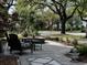 Charming stone patio with outdoor seating and beautiful landscaping at 124 Orange St., Georgetown, SC 29440