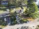 Aerial view of a charming home with a lush green lawn and tree-lined street at 1300 Ragin St., Myrtle Beach, SC 29577
