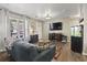 Cozy living room featuring sofa, hardwood floors, and fish tank at 1300 Ragin St., Myrtle Beach, SC 29577