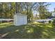 Backyard view featuring a storage shed and hammock for relaxation at 1300 Ragin St., Myrtle Beach, SC 29577