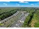 Stunning aerial view of a condo community showcasing lush landscaping, water features and ample parking at 1302 River Oak Dr. # 4B, Myrtle Beach, SC 29579