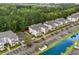Scenic aerial view of condo building with parking, surrounding by trees with waterway in the distance at 1302 River Oak Dr. # 4B, Myrtle Beach, SC 29579