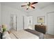 Serene bedroom featuring a sleek dresser, a plush bed, and a view into an adjoining bathroom, offering comfort at 1302 River Oak Dr. # 4B, Myrtle Beach, SC 29579