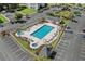Community pool aerial view with a hot tub, ample lounge seating and nearby parking at 1302 River Oak Dr. # 4B, Myrtle Beach, SC 29579